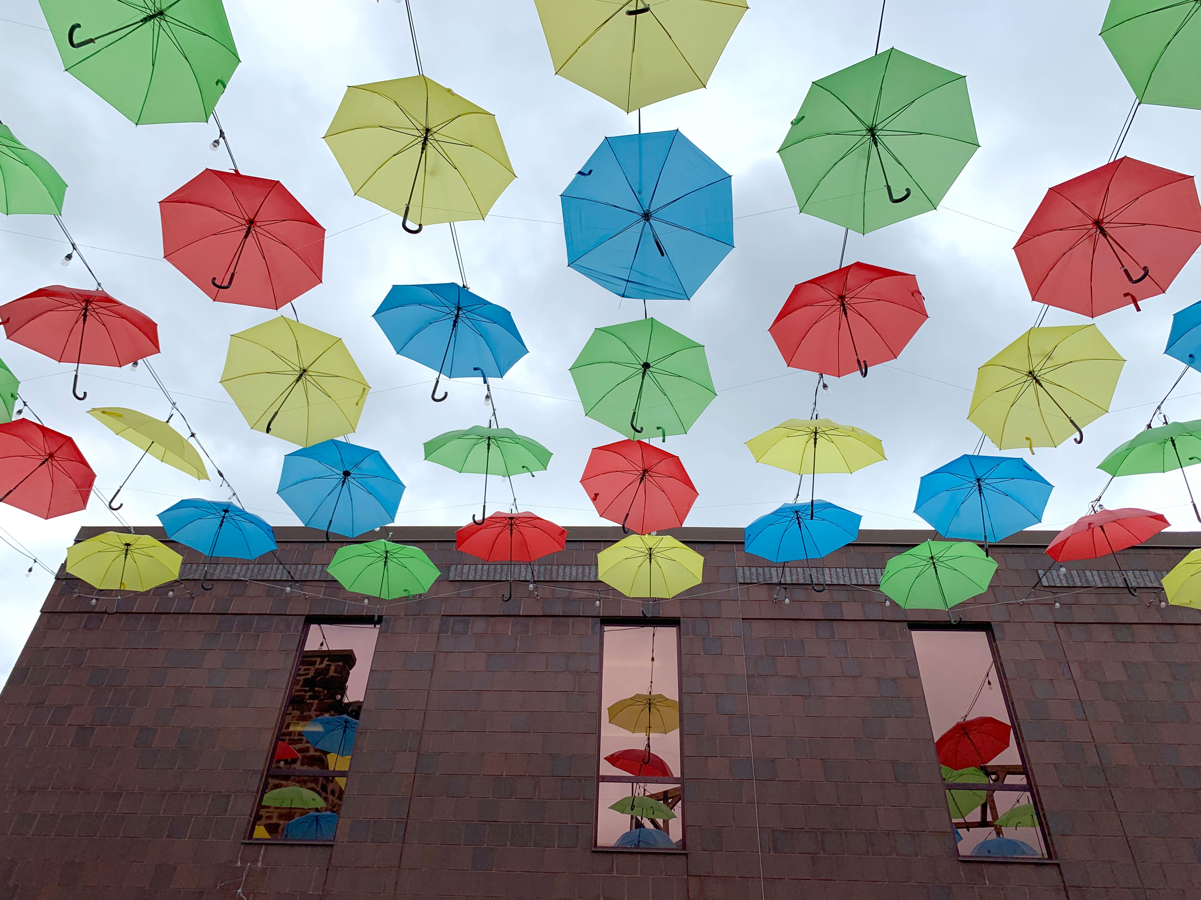 colorful umbrellas hanging in the sky