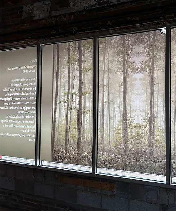 Printed banner of a forest with poetry