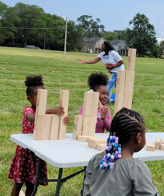 Kids playing with wooden blocks on a table