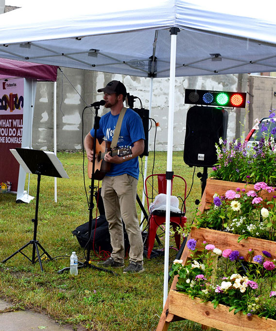 Man singing and playing guitar