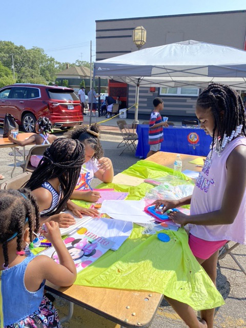 Girls working on an art project at a table