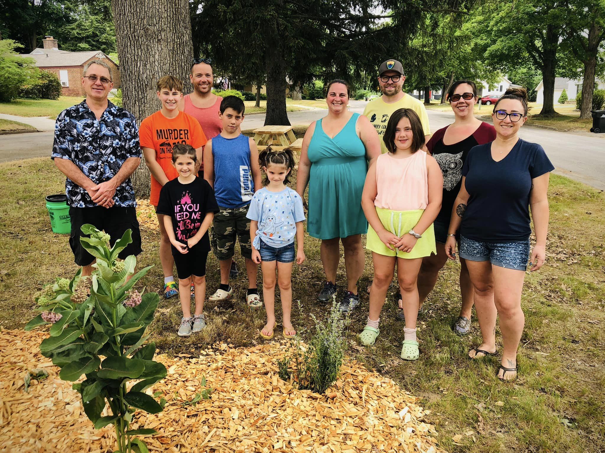 Group photo of people standing in a park